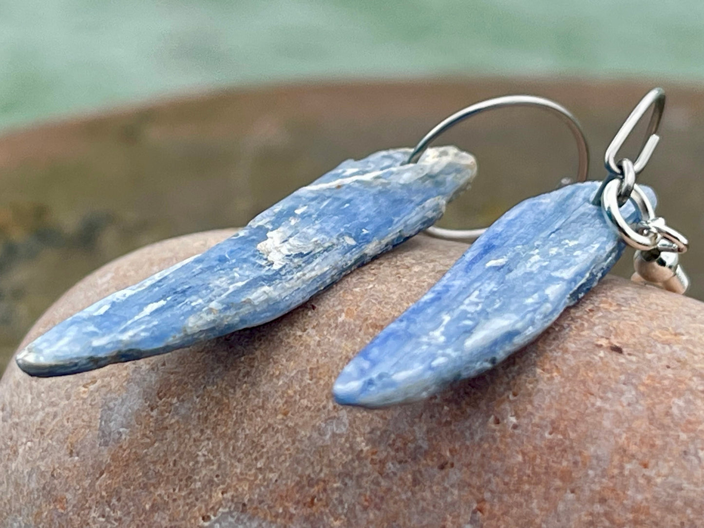 Blue kyanite earrings hung on recycled sterling silver. Angel wing earrings. Unique jewellery. handmade unusual jewellery, ethically made.