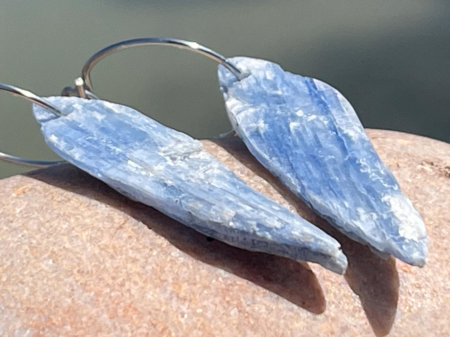 Blue kyanite earrings hung on recycled sterling silver. Angel wing earrings. Unique jewellery. handmade unusual jewellery, ethically made.