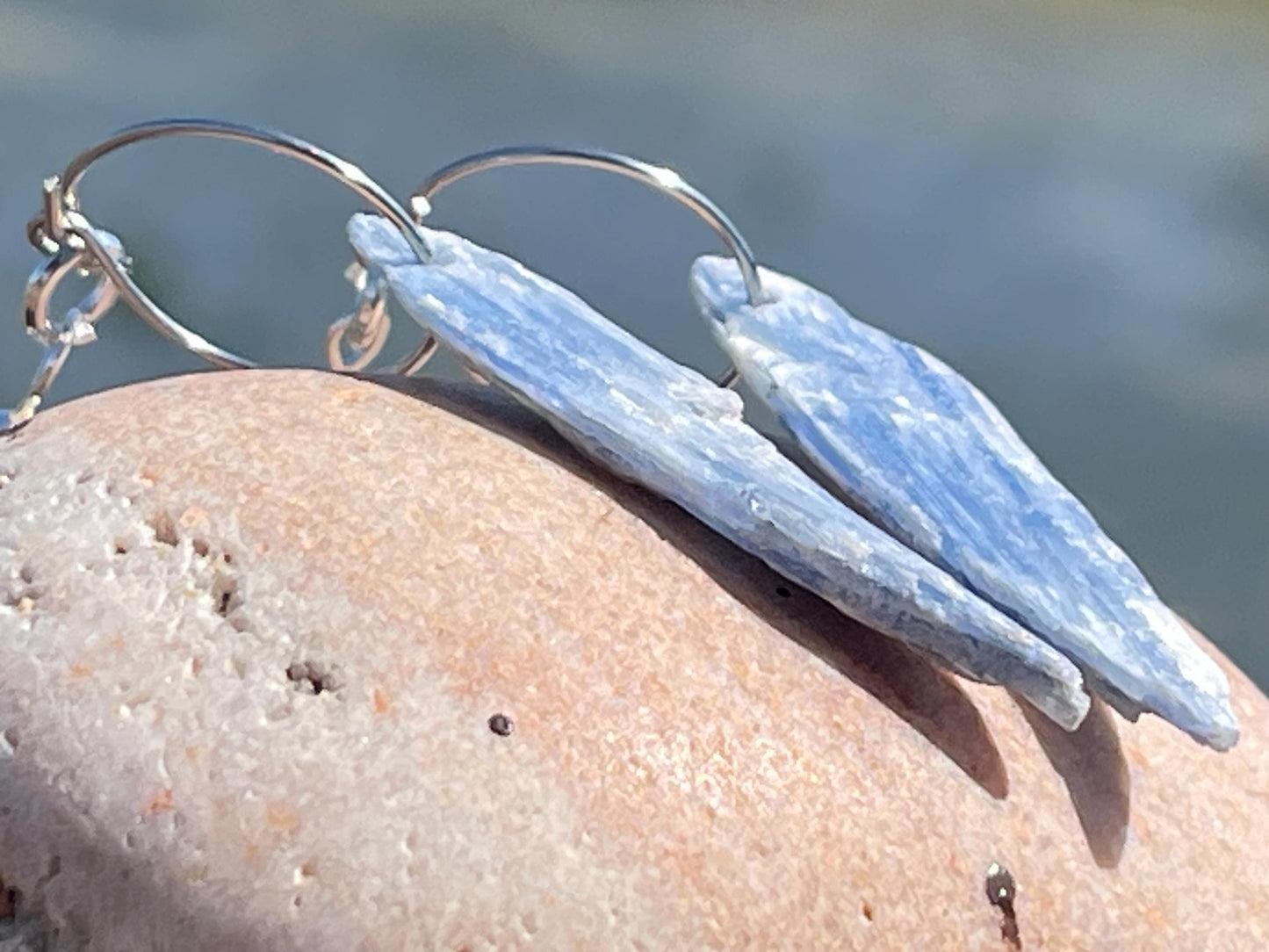 Blue kyanite earrings hung on recycled sterling silver. Angel wing earrings. Unique jewellery. handmade unusual jewellery, ethically made.