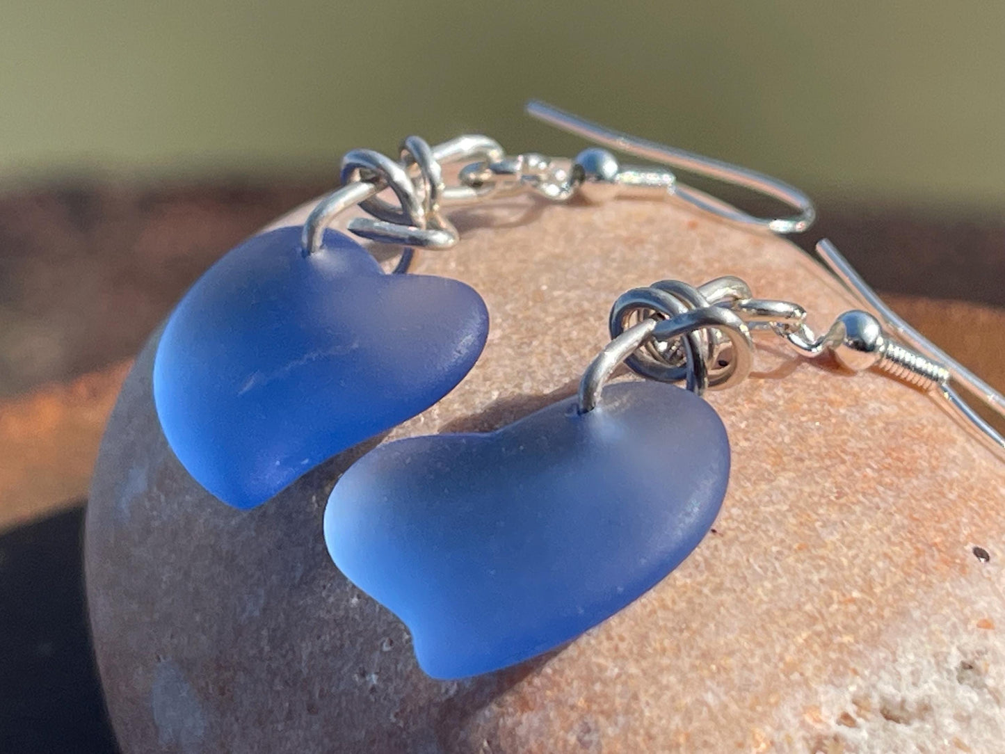 Sea glass heart earrings iron recycled sterling silver. Eco conscious jewellery. Ethical jewellery. Blue sea glass hearts. Handmade earrings
