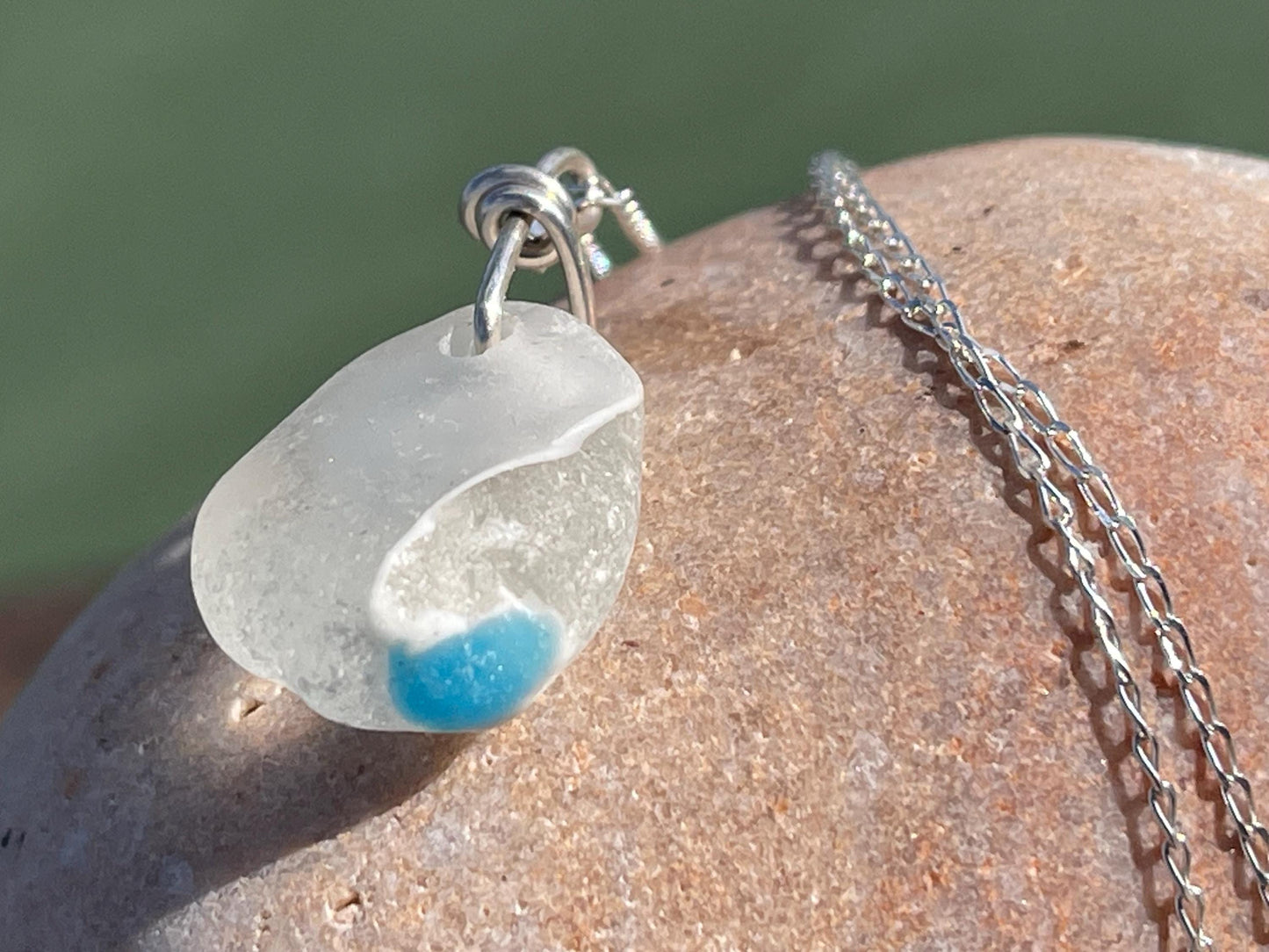 Eco friendly sea glass necklace on a sterling silver chain showcasing a little octopus. Octopus pendant, octopus necklace, ethical jewellery