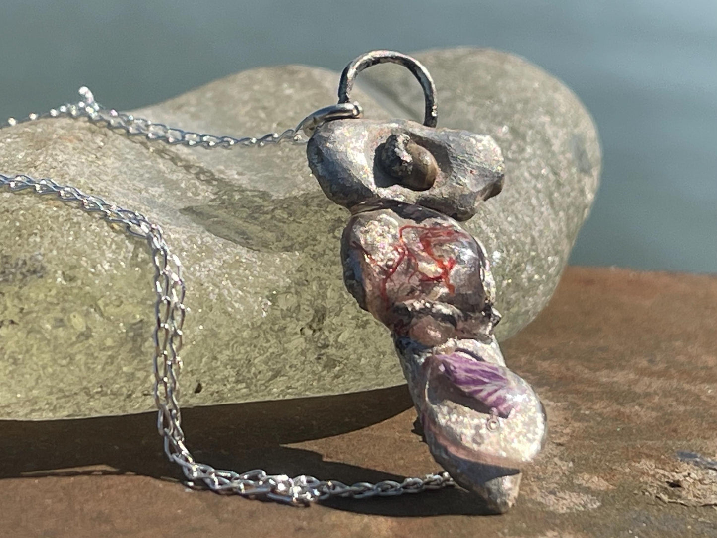 Recycled silver artisan necklace. On sale as it is a practice piece. Integrating seaweed and a violet petal. Unique silver artisan necklace.