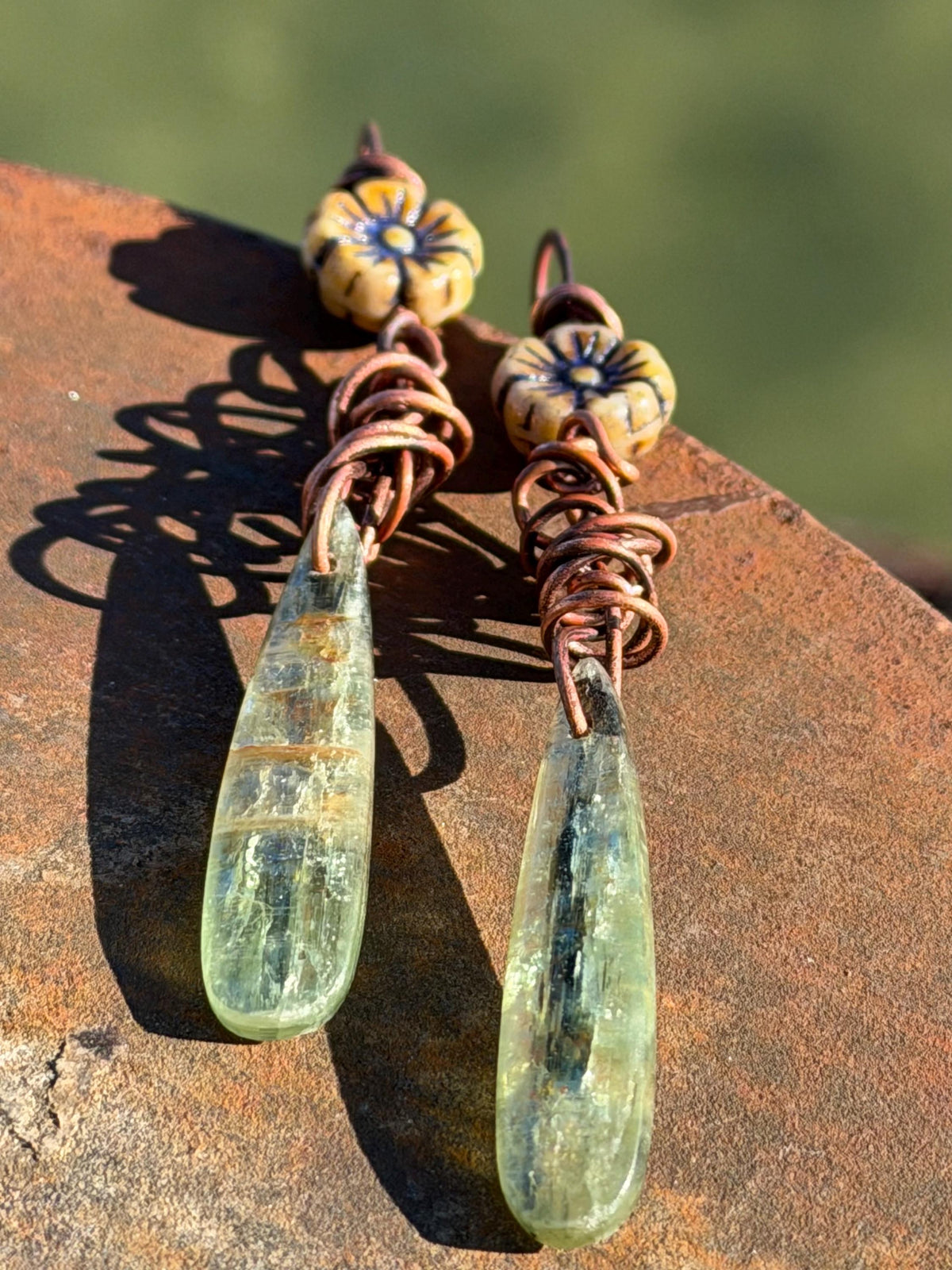 Green kyanite earrings hung on recycled copper. Unique gemstone jewellery. handmade unusual jewellery, ethically made. Eco friendly earrings