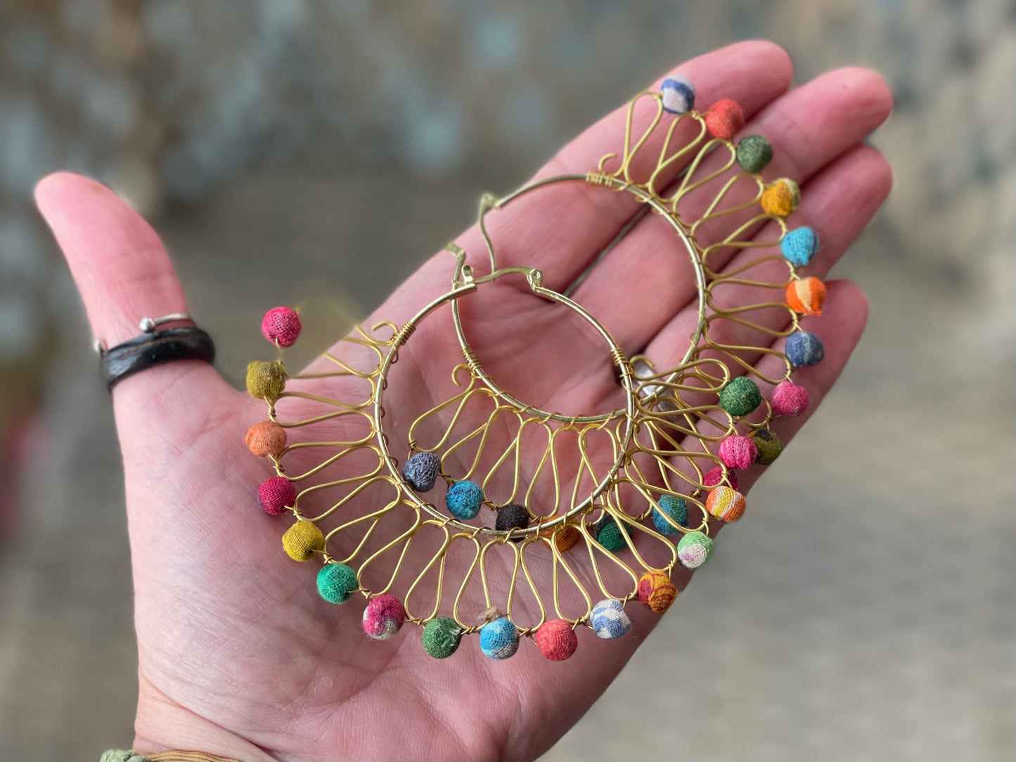 Handmade earrings made from waste textiles