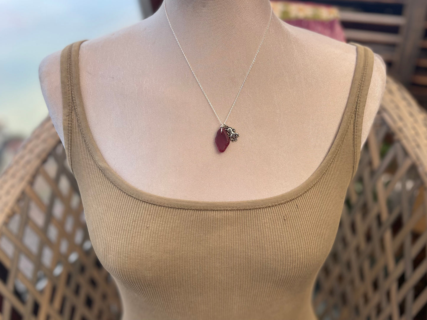 Eco friendly sea glass necklace on a sterling silver chain showcasing a little octopus. Octopus pendant, octopus necklace, ethical jewellery