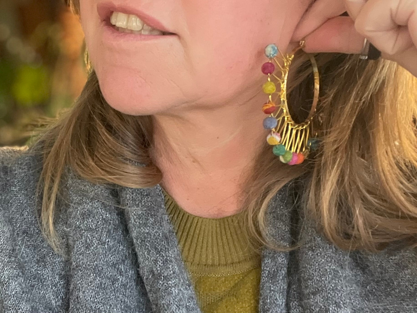 Handmade earrings made from waste textiles