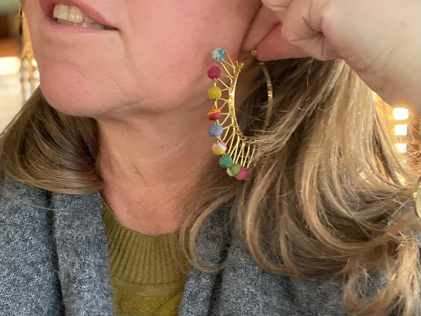 Handmade earrings made from waste textiles