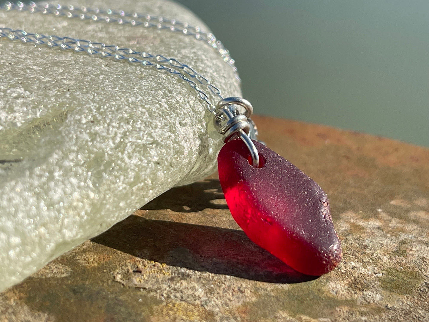Eco friendly sea glass necklace on a sterling silver chain showcasing a little octopus. Octopus pendant, octopus necklace, ethical jewellery