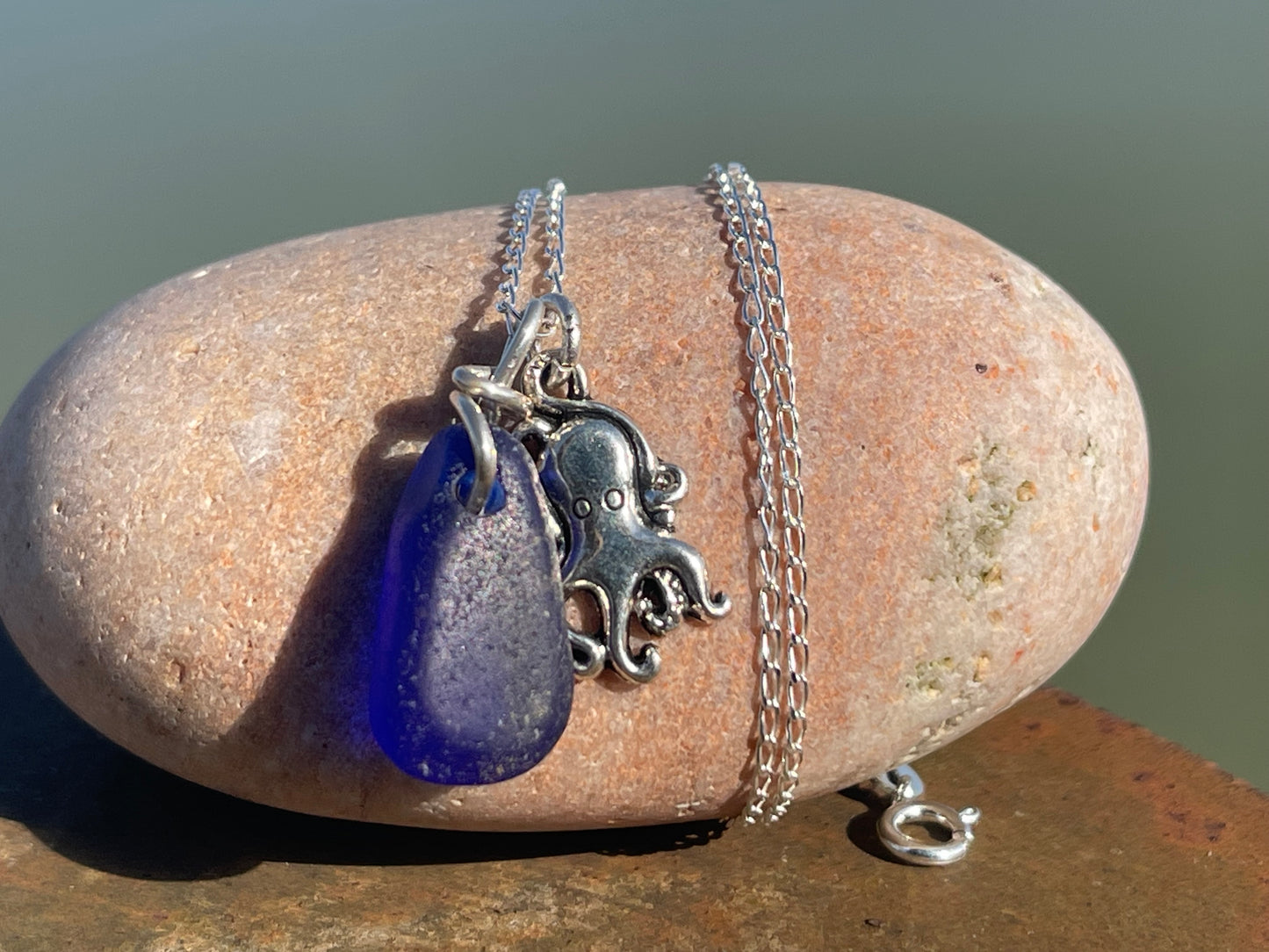 Eco friendly sea glass necklace on a sterling silver chain showcasing a little octopus. Octopus pendant, octopus necklace, ethical jewellery
