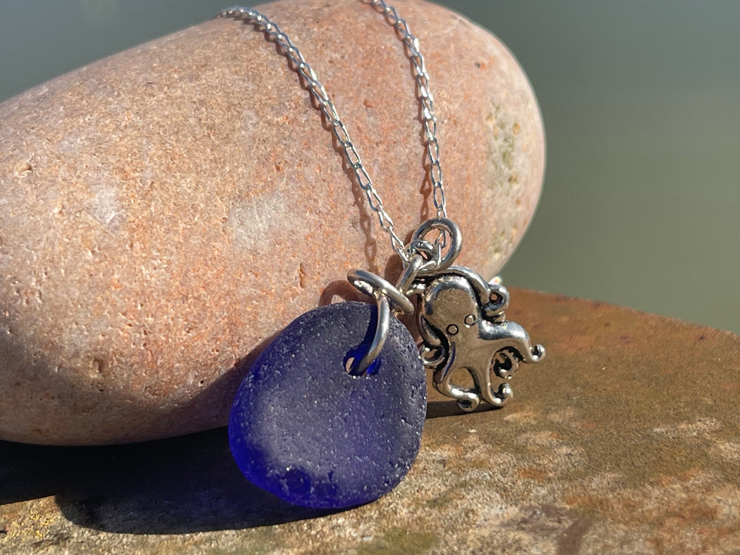 Eco friendly sea glass necklace on a sterling silver chain showcasing a little octopus. Octopus pendant, octopus necklace, ethical jewellery