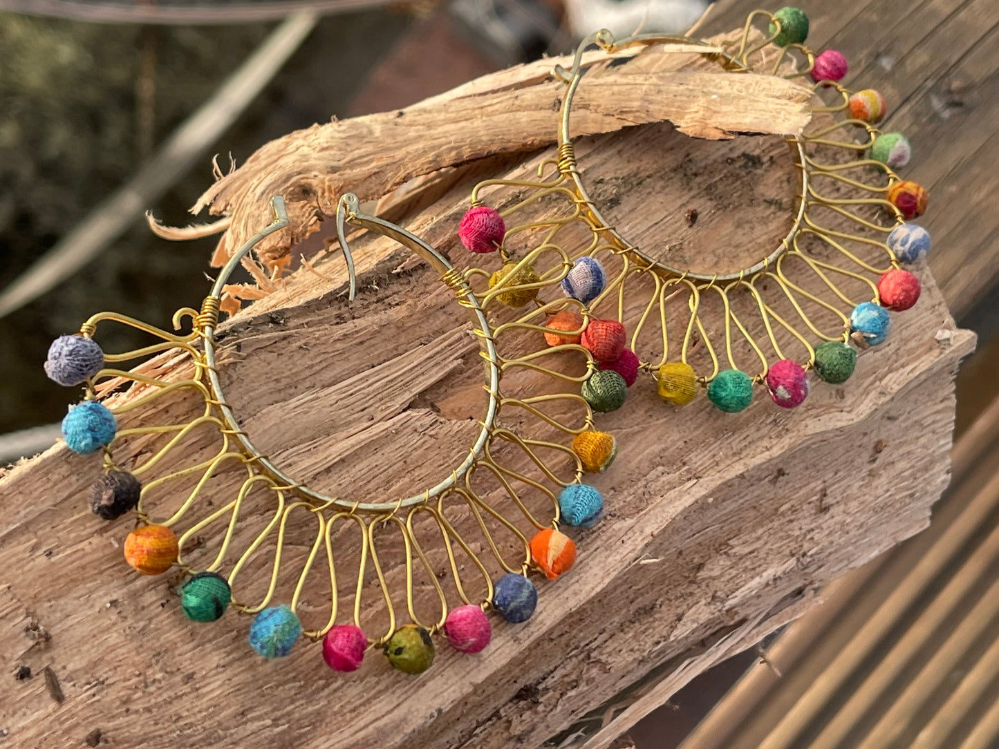 Handmade earrings made from waste textiles