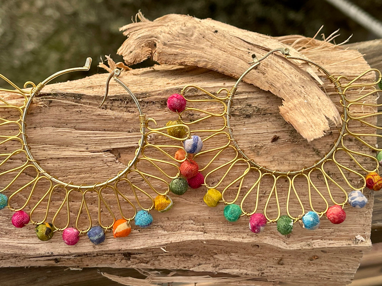 Handmade earrings made from waste textiles