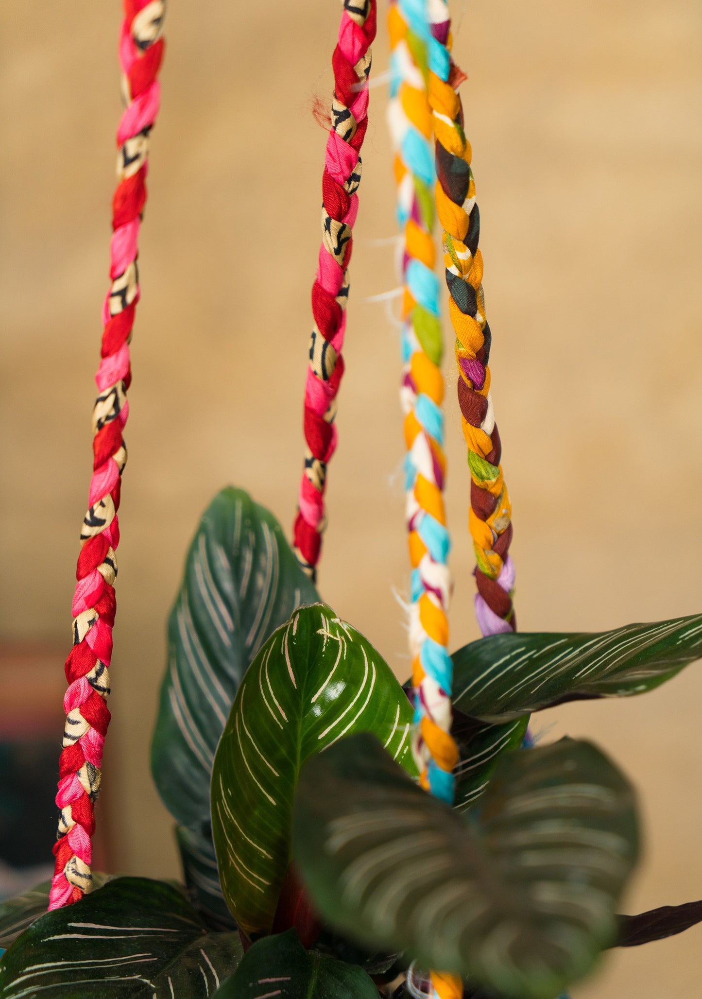 Hanging plant holder made from recycled saris. Eco friendly plant hanger. Colourful home decor.