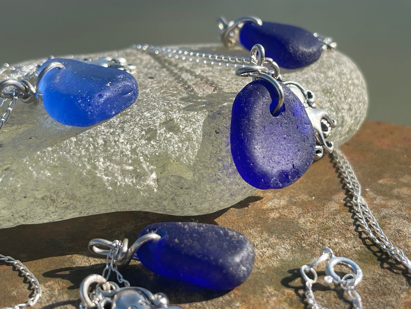 Eco friendly sea glass necklace on a sterling silver chain showcasing a little octopus. Octopus pendant, octopus necklace, ethical jewellery