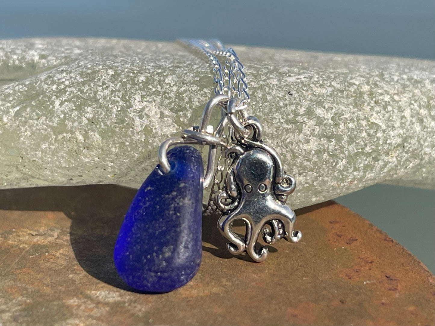 Eco friendly sea glass necklace on a sterling silver chain showcasing a little octopus. Octopus pendant, octopus necklace, ethical jewellery