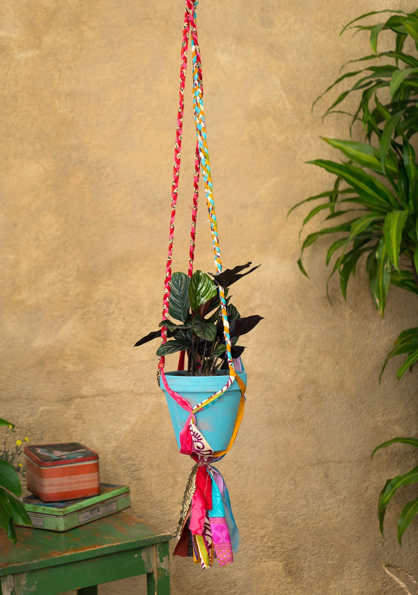 Hanging plant holder made from recycled saris. Eco friendly plant hanger. Colourful home decor.