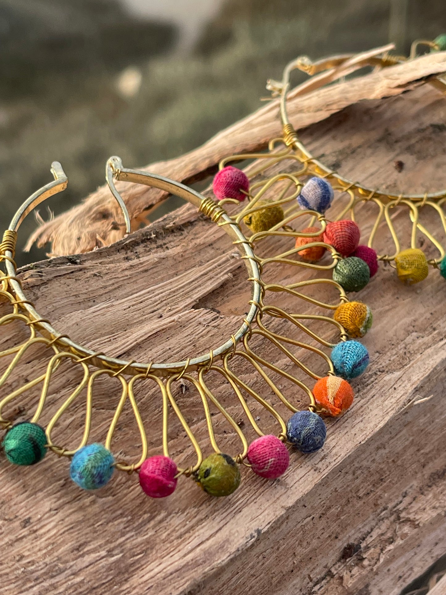 Handmade earrings made from waste textiles