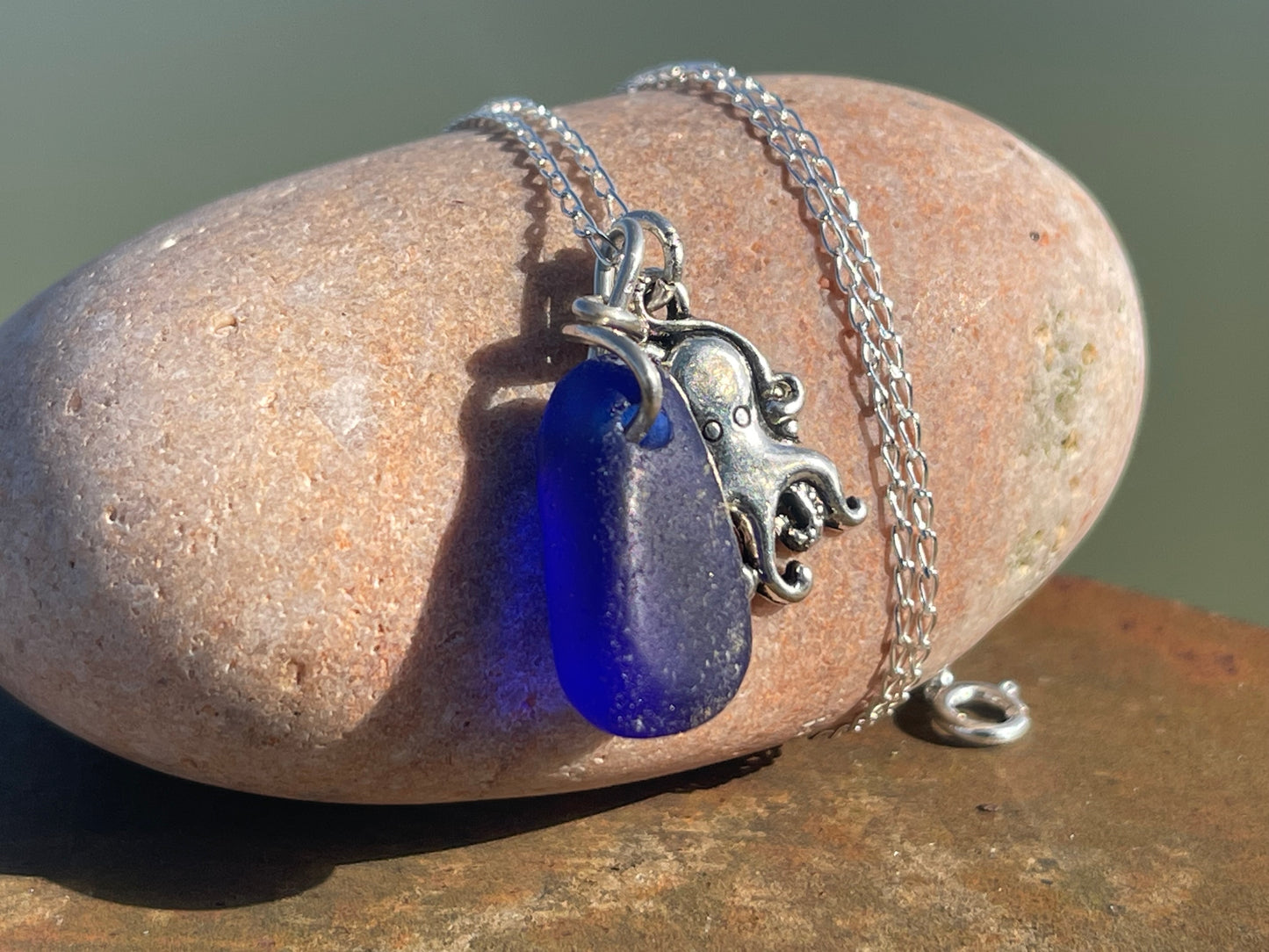Eco friendly sea glass necklace on a sterling silver chain showcasing a little octopus. Octopus pendant, octopus necklace, ethical jewellery