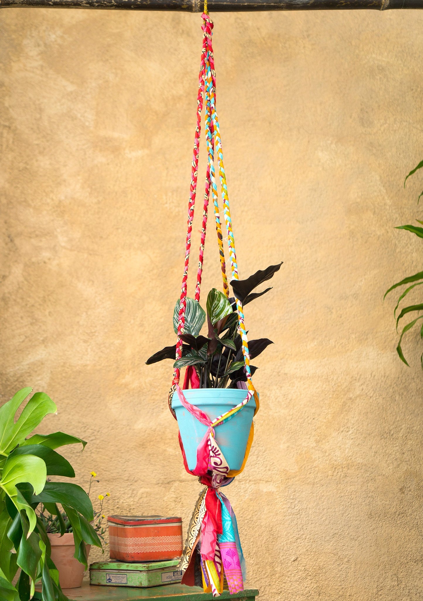 Hanging plant holder made from recycled saris. Eco friendly plant hanger. Colourful home decor.