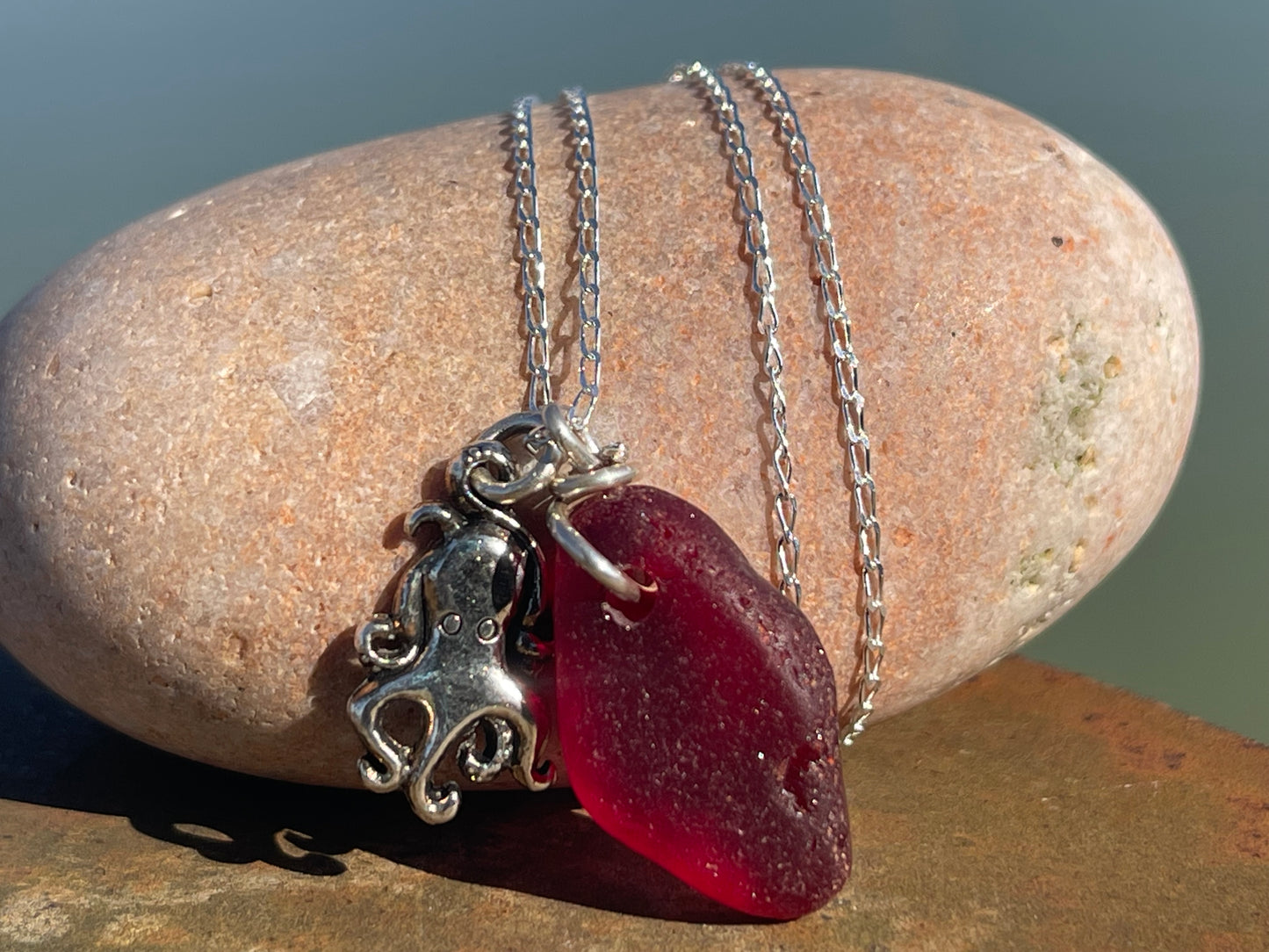 Eco friendly sea glass necklace on a sterling silver chain showcasing a little octopus. Octopus pendant, octopus necklace, ethical jewellery