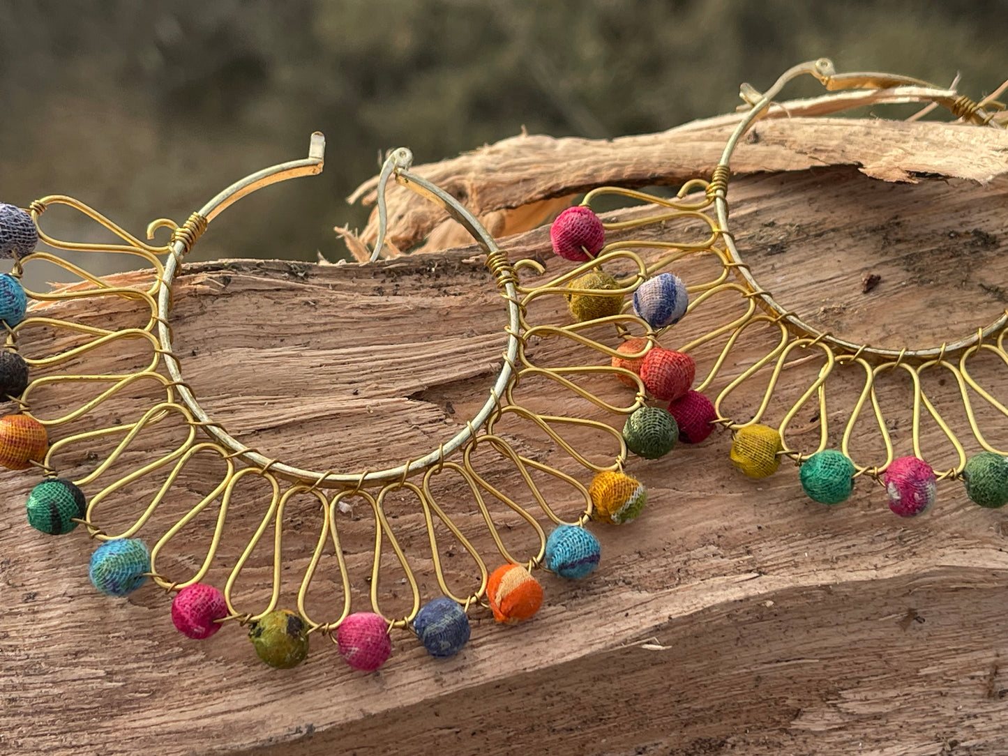 Handmade earrings made from waste textiles