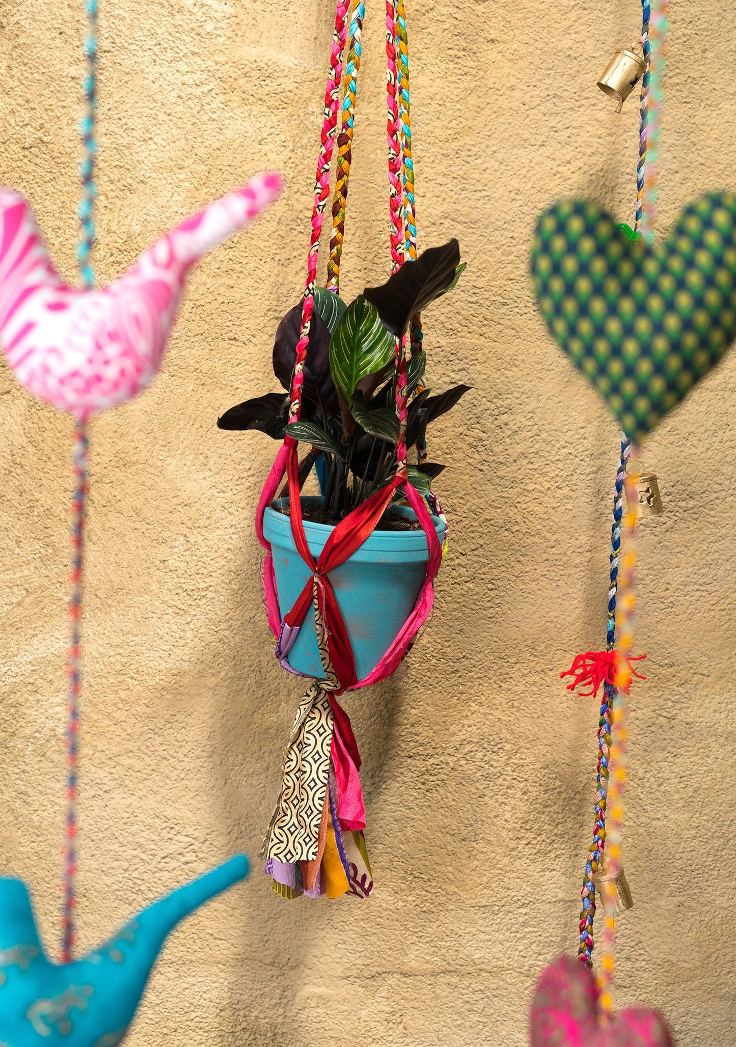 Hanging plant holder made from recycled saris. Eco friendly plant hanger. Colourful home decor.