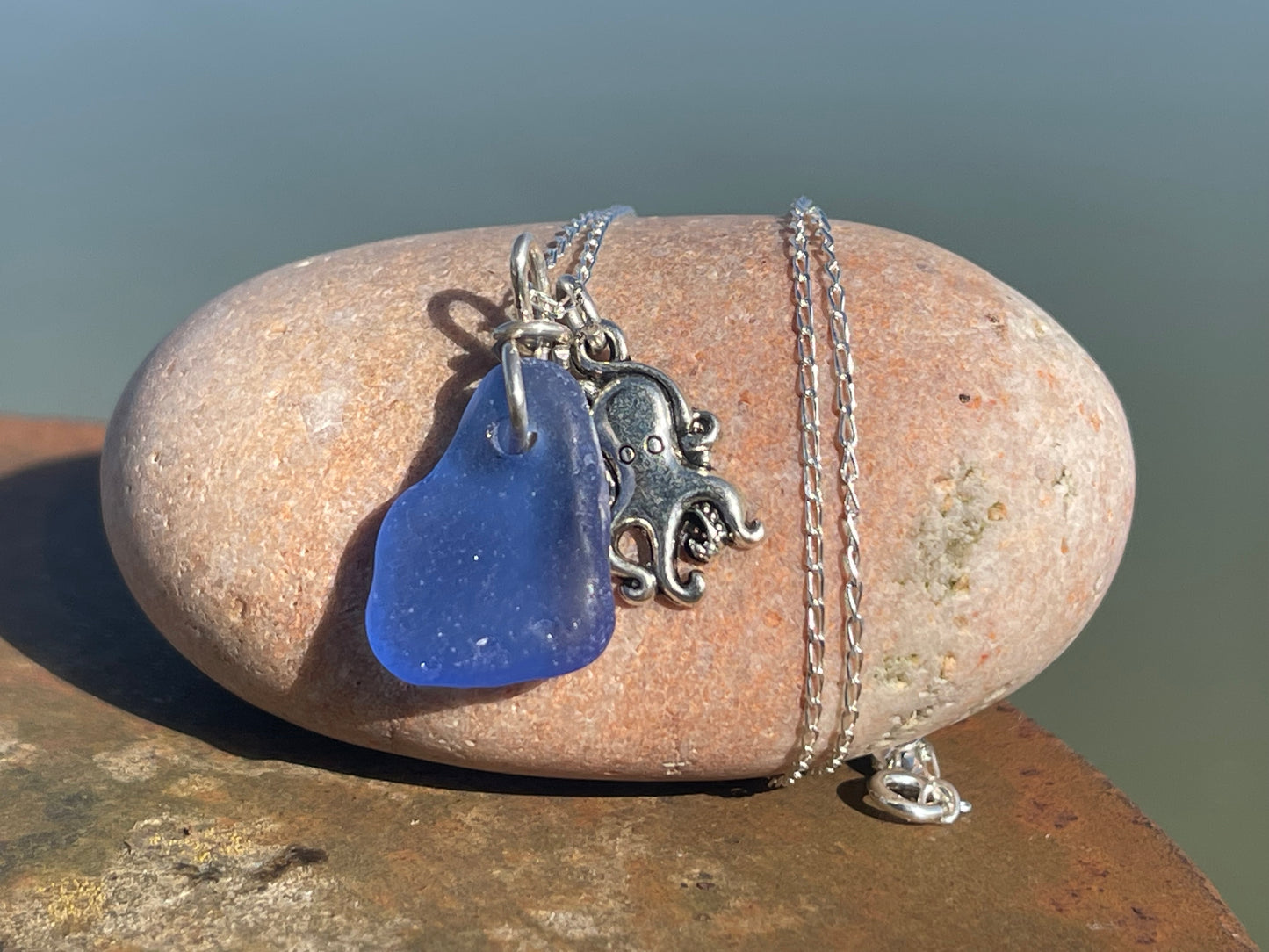 Eco friendly sea glass necklace on a sterling silver chain showcasing a little octopus. Octopus pendant, octopus necklace, ethical jewellery