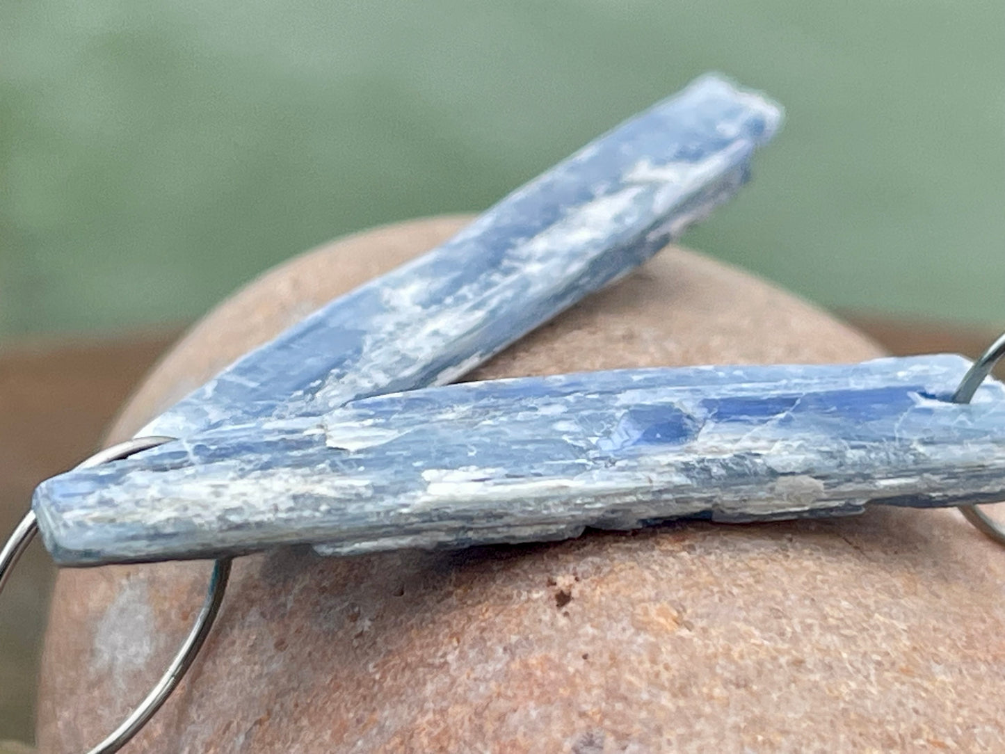 Blue kyanite earrings hung on recycled sterling silver. Angel wing earrings. Unique jewellery. handmade unusual jewellery, ethically made.