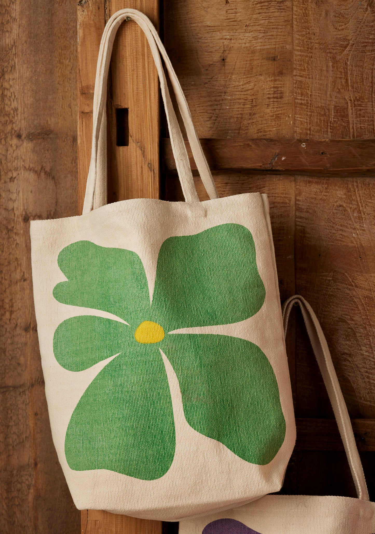 Bright joyful recycled cotton bags with bold flower prints. Long handles. Thick strong cotton.