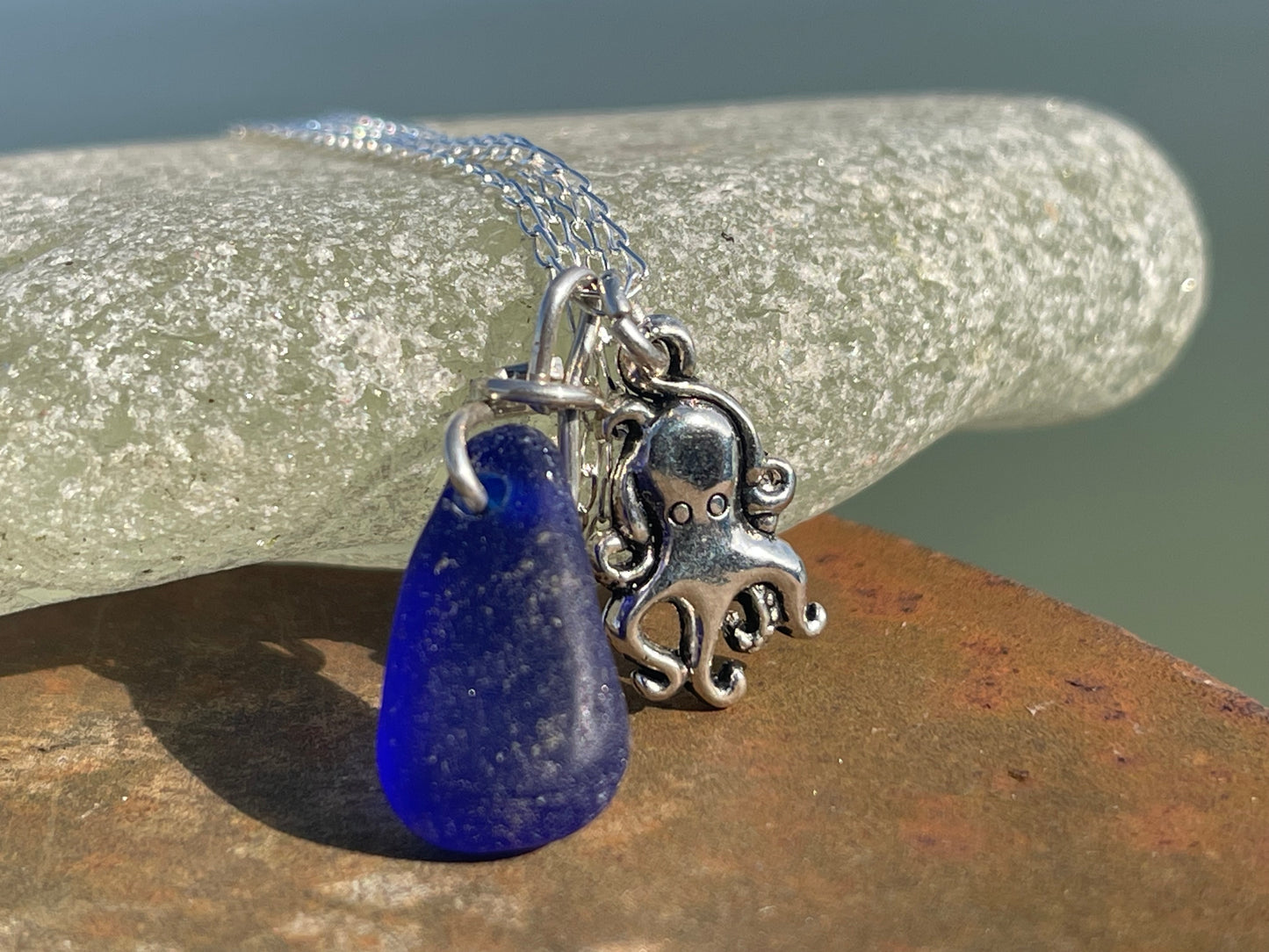 Eco friendly sea glass necklace on a sterling silver chain showcasing a little octopus. Octopus pendant, octopus necklace, ethical jewellery
