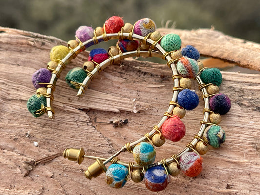 Handmade earrings made from waste textiles