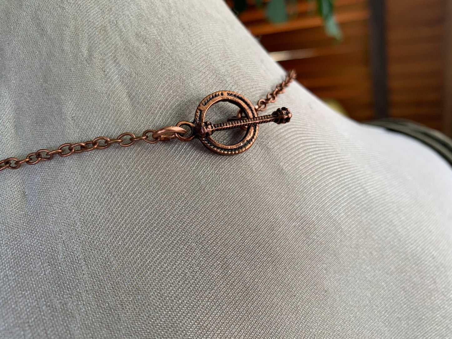 Eco friendly handmade necklace made from Rhodochrosite & naturally weathered recycled copper. Ethical jewellery. Unique handmade jewellery.
