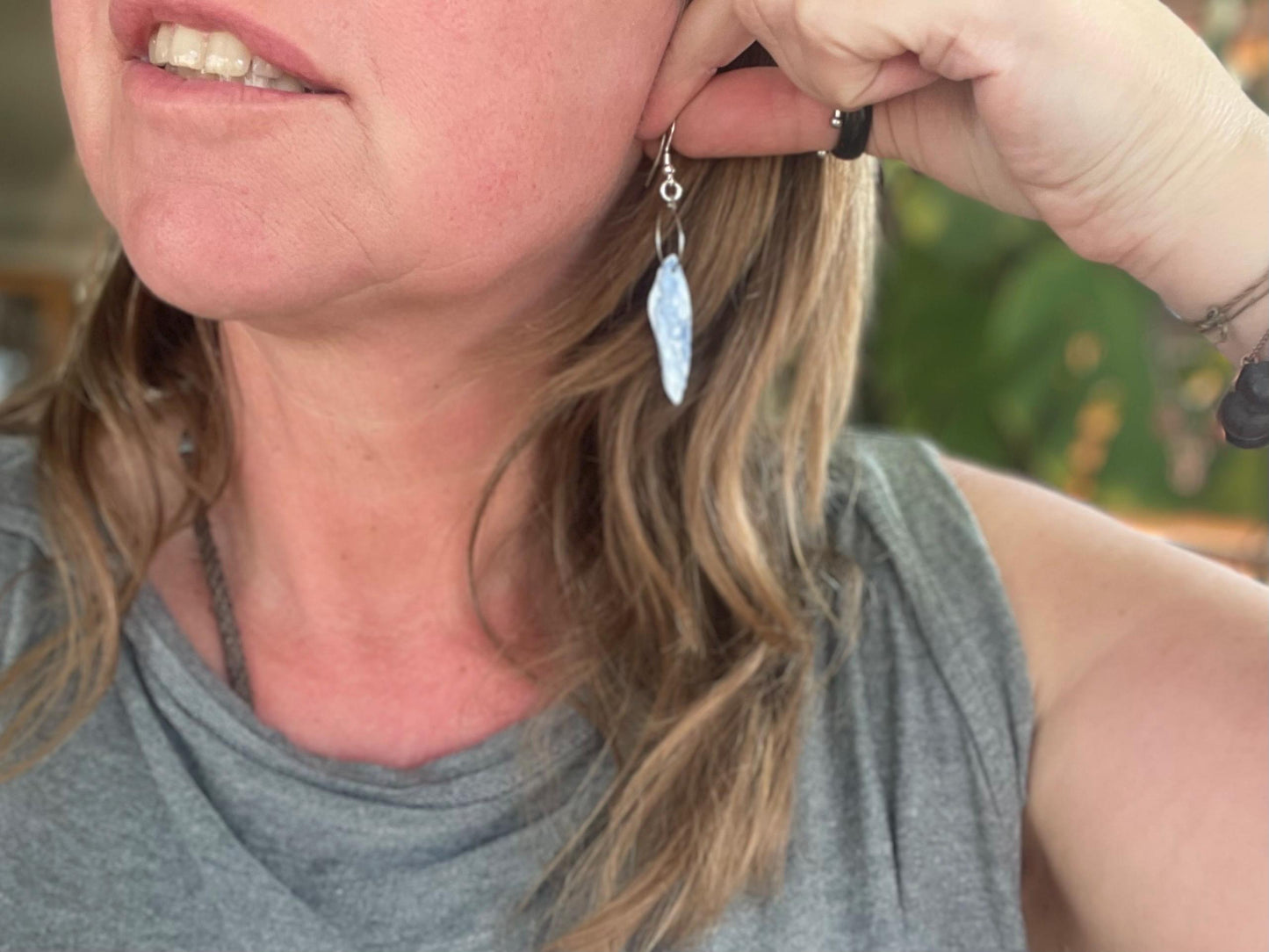Blue kyanite earrings hung on recycled sterling silver. Angel wing earrings. Unique jewellery. handmade unusual jewellery, ethically made.