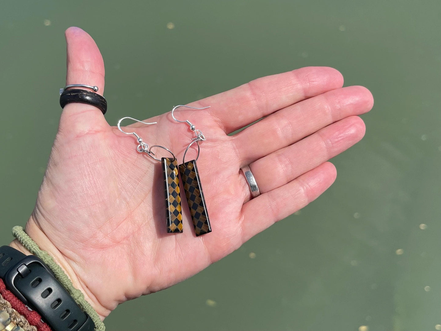 Obsidian and tigers eye gemstone earrings on sterling silver. Ethical and unique jewellery. Unique handmade earrings.