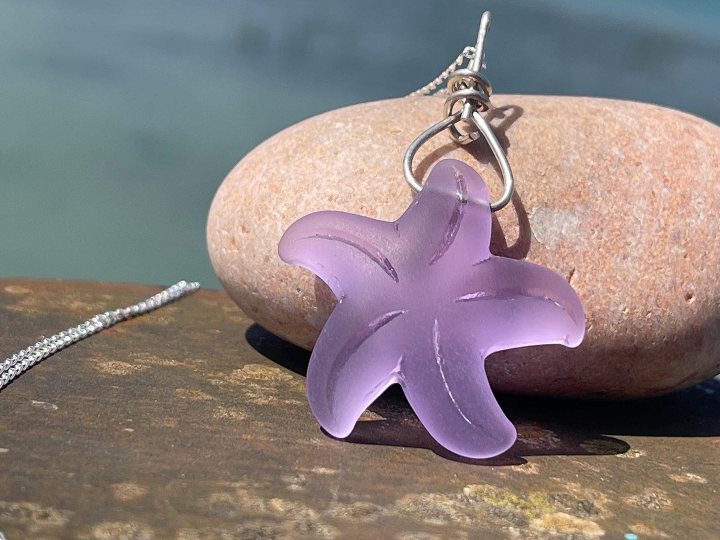 Eco friendly glass necklace on a sterling silver chain showcasing a pink starfish pendant, starfish  necklace, ethical jewellery