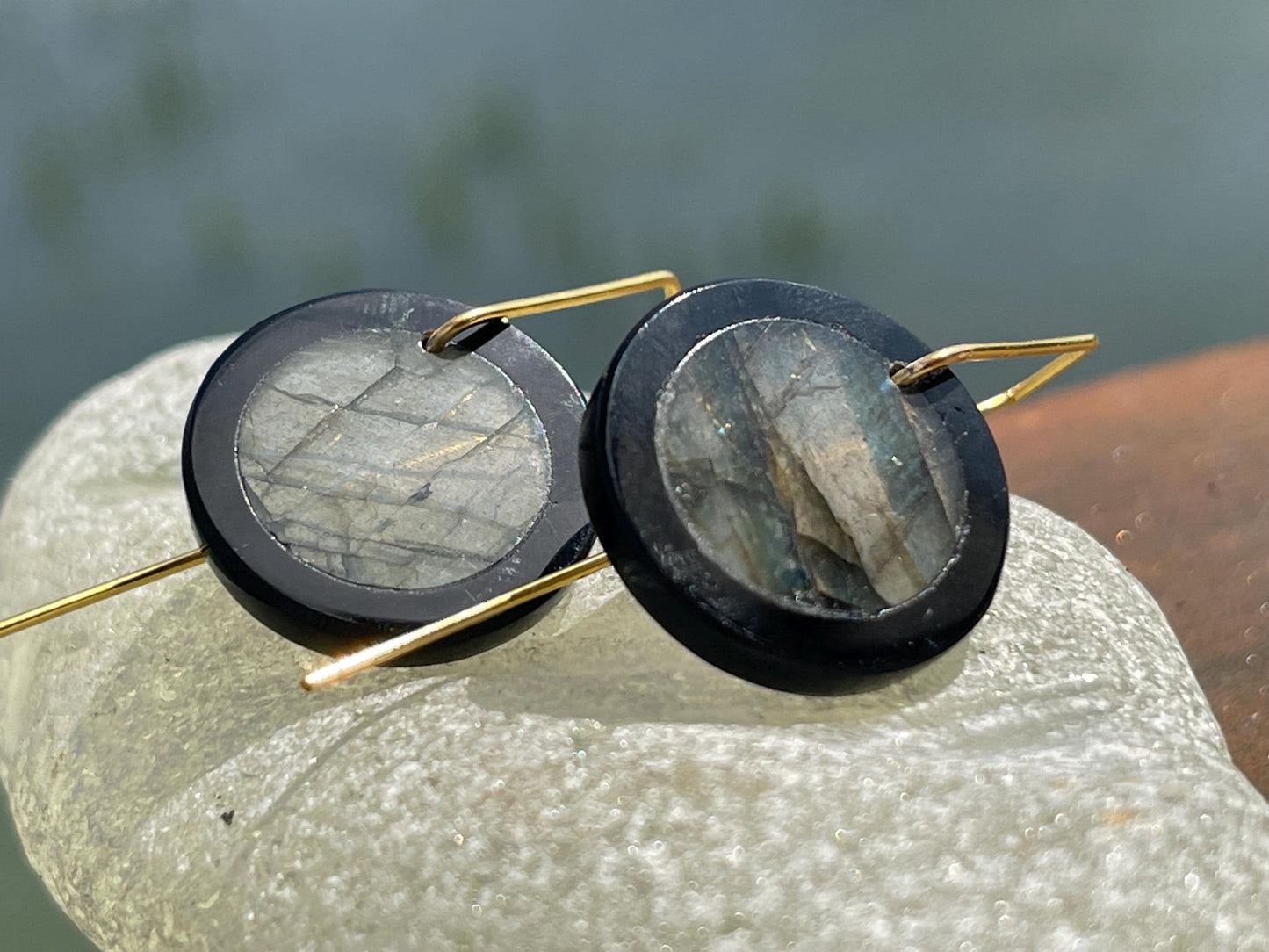 Ethically sourced labradorite and black onyx earrings held on recycled brass. Ethical jewellery, labradorite jewellery. Boho unique earrings