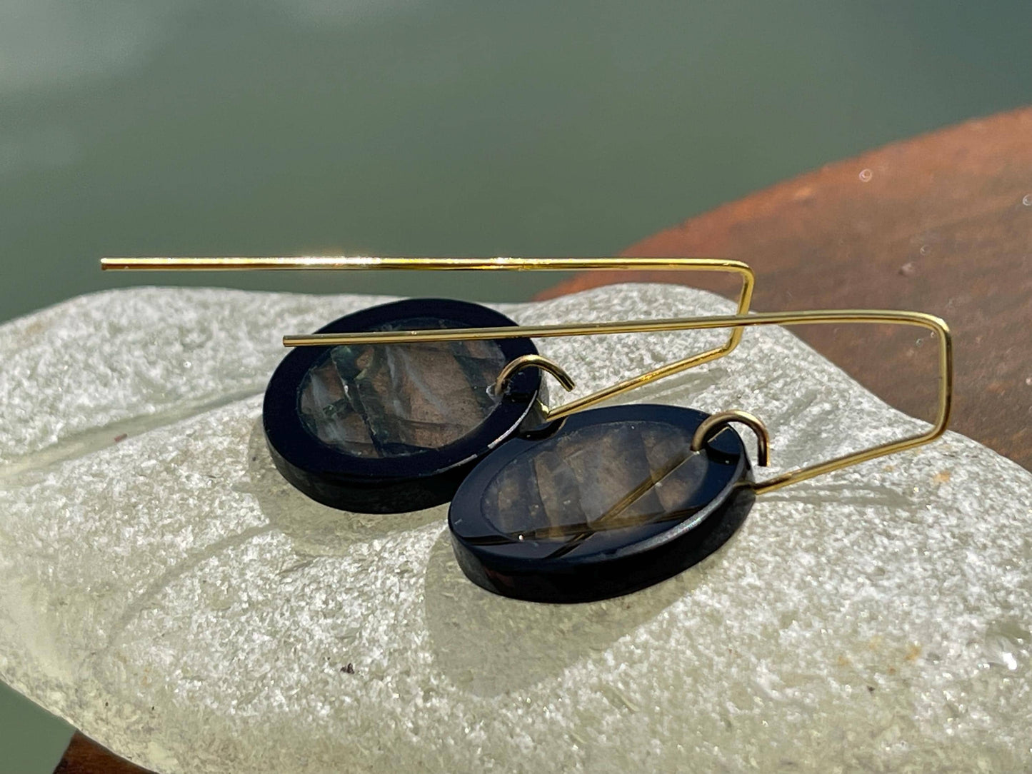 Ethically sourced labradorite and black onyx earrings held on recycled brass. Ethical jewellery, labradorite jewellery. Boho unique earrings