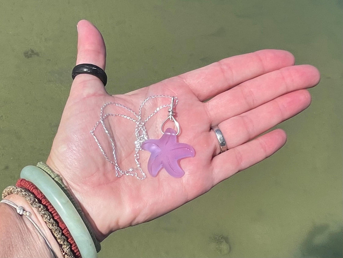 Eco friendly glass necklace on a sterling silver chain showcasing a pink starfish pendant, starfish  necklace, ethical jewellery