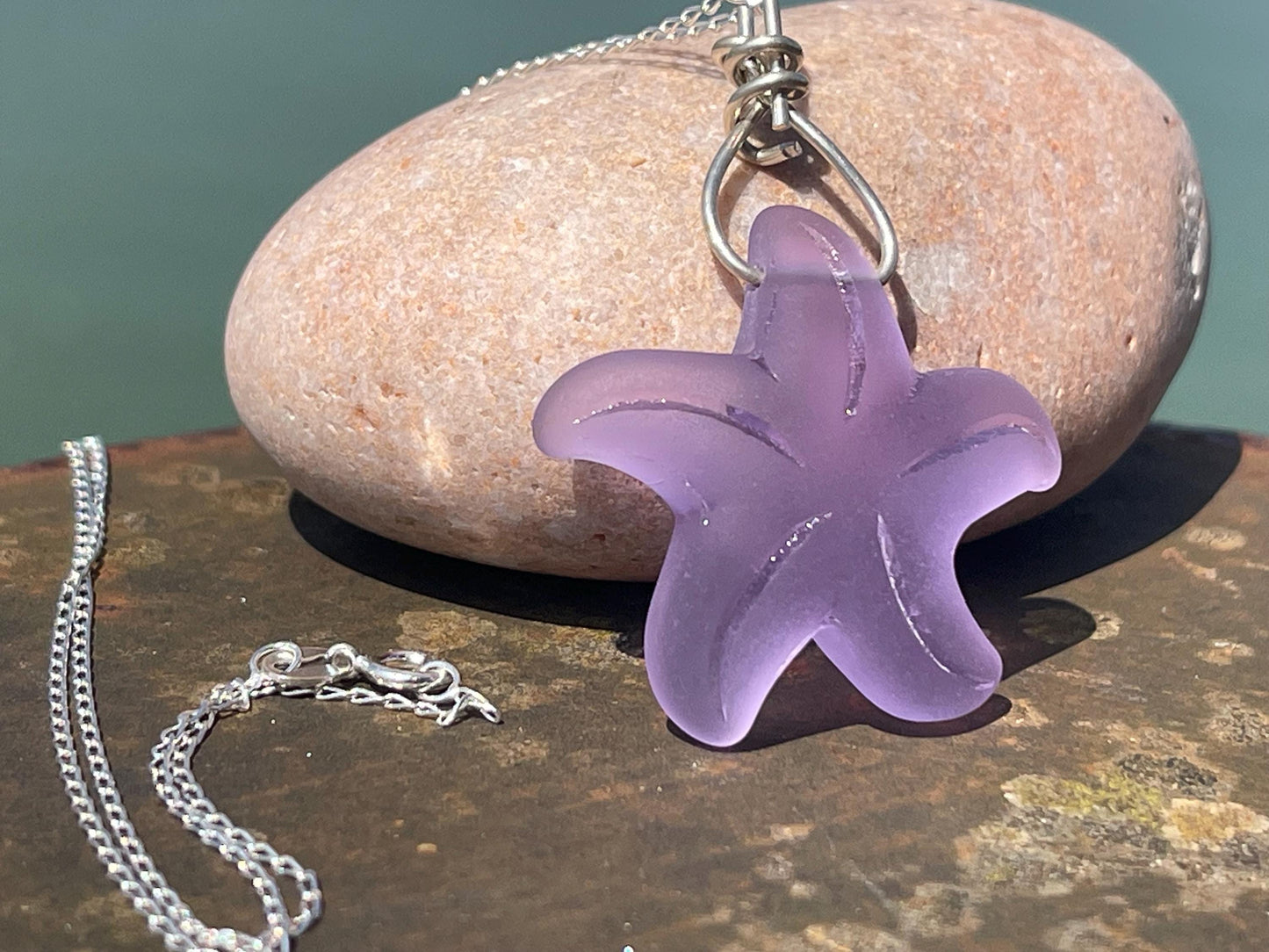 Eco friendly glass necklace on a sterling silver chain showcasing a pink starfish pendant, starfish  necklace, ethical jewellery