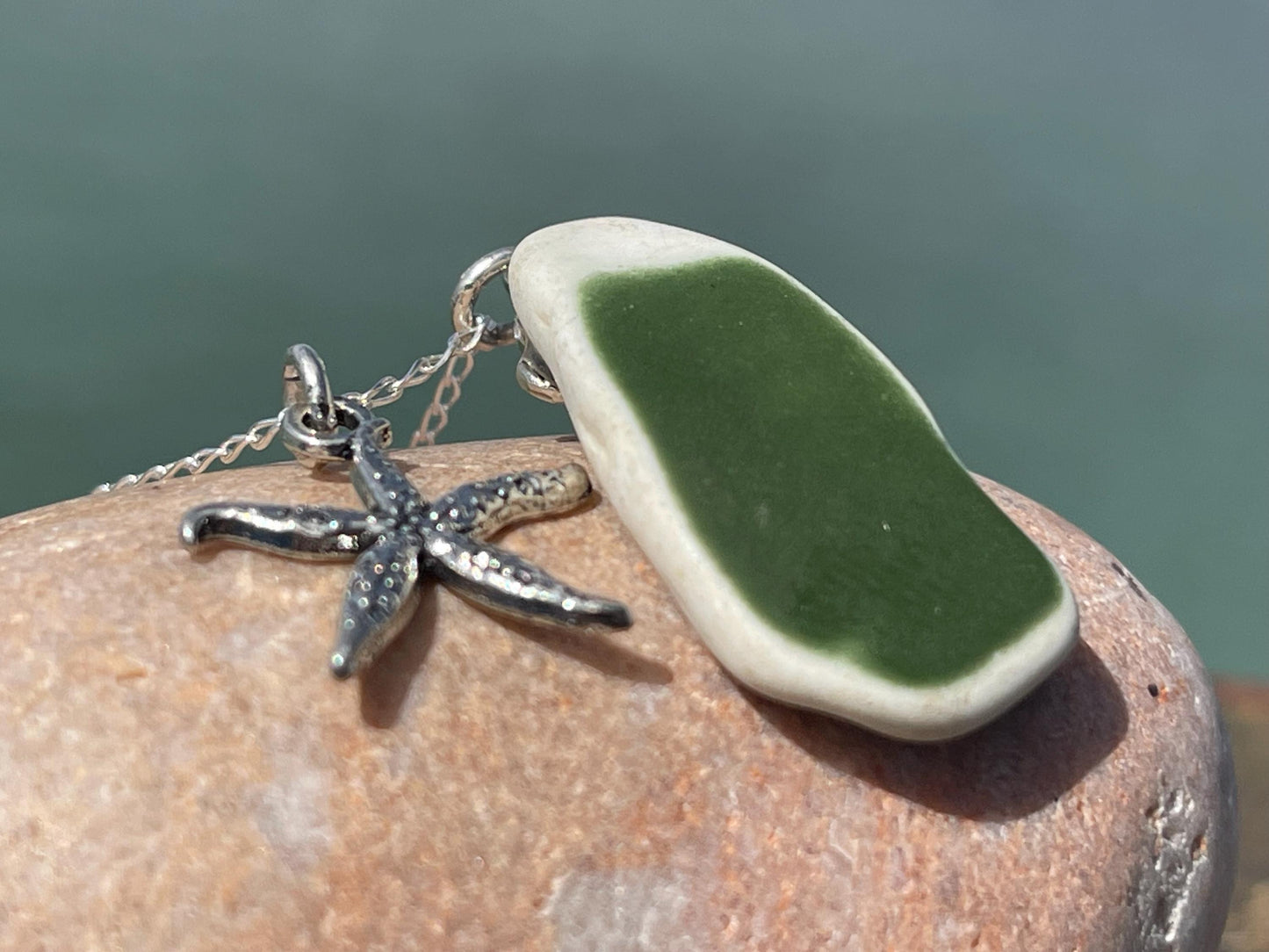 Eco friendly sea ceramic necklace on a sterling silver chain showcasing a little starfish pendant, starfish necklace, ethical jewellery