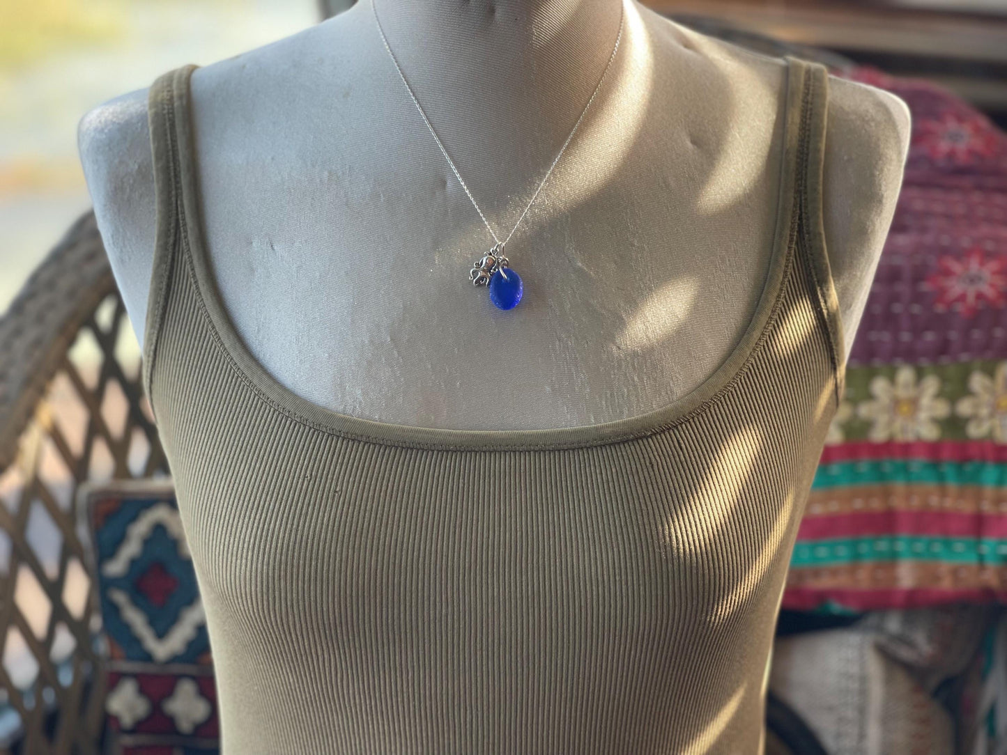 Eco friendly sea glass necklace on a sterling silver chain showcasing a little octopus. Octopus pendant, octopus necklace, ethical jewellery