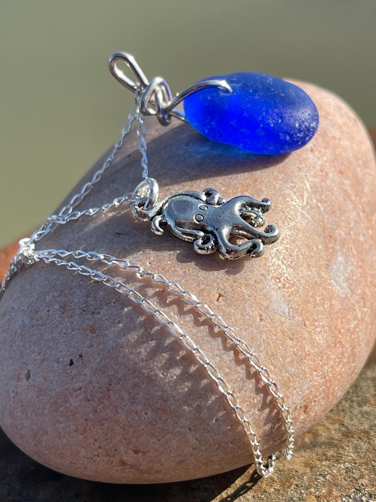 Eco friendly sea glass necklace on a sterling silver chain showcasing a little octopus. Octopus pendant, octopus necklace, ethical jewellery