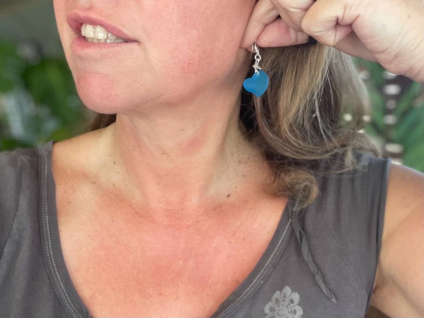 Sea glass heart earrings iron recycled sterling silver. Eco conscious jewellery. Ethical jewellery. Blue sea glass hearts. Handmade earrings