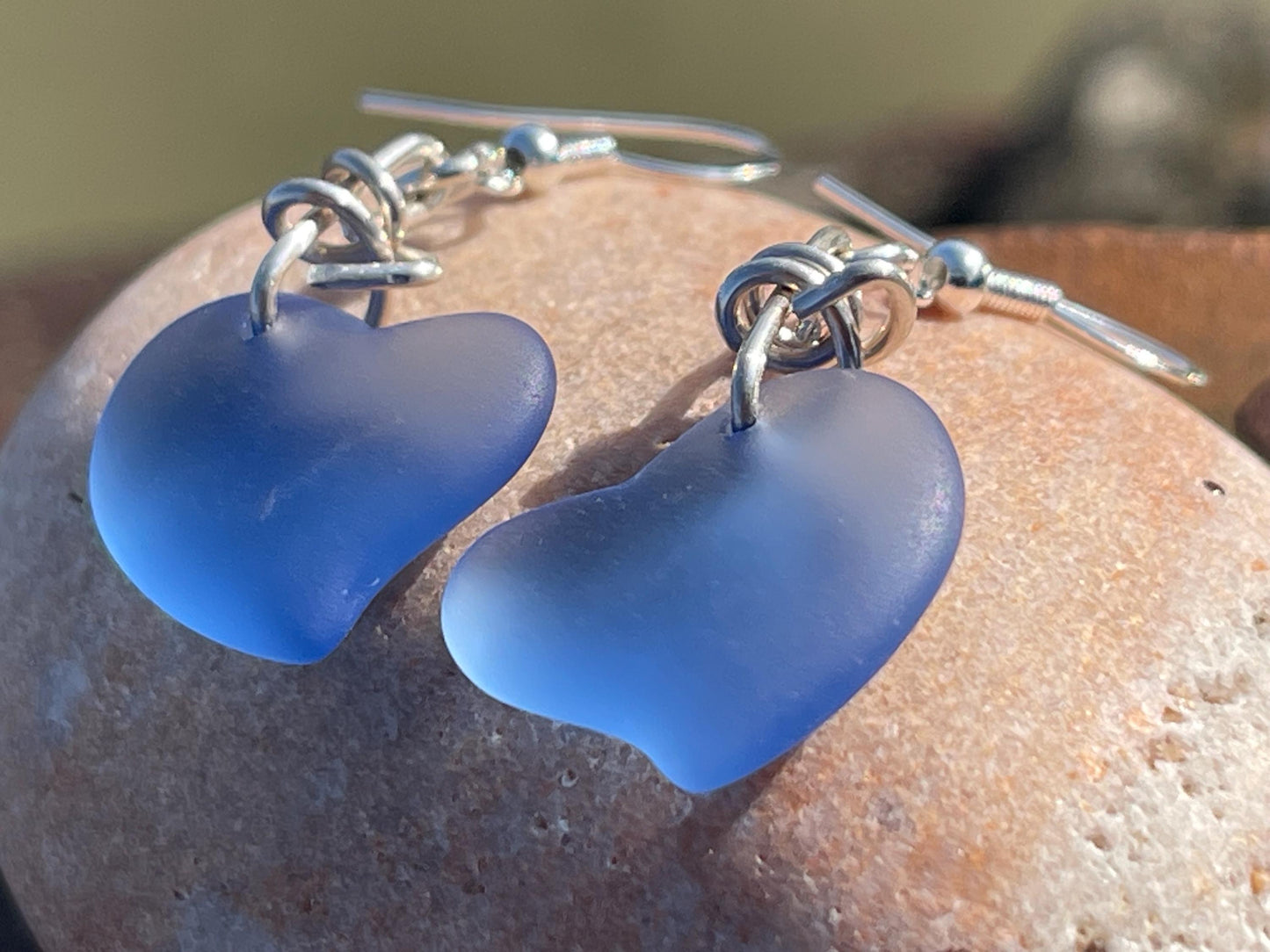 Sea glass heart earrings iron recycled sterling silver. Eco conscious jewellery. Ethical jewellery. Blue sea glass hearts. Handmade earrings
