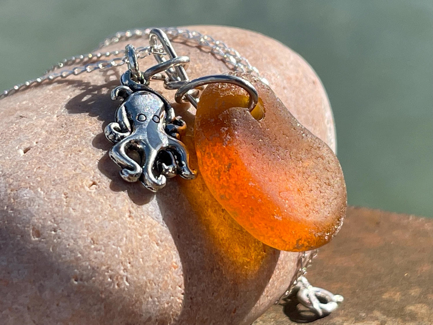 Eco friendly sea glass necklace on a sterling silver chain showcasing a little octopus. Octopus pendant, octopus necklace, ethical jewellery