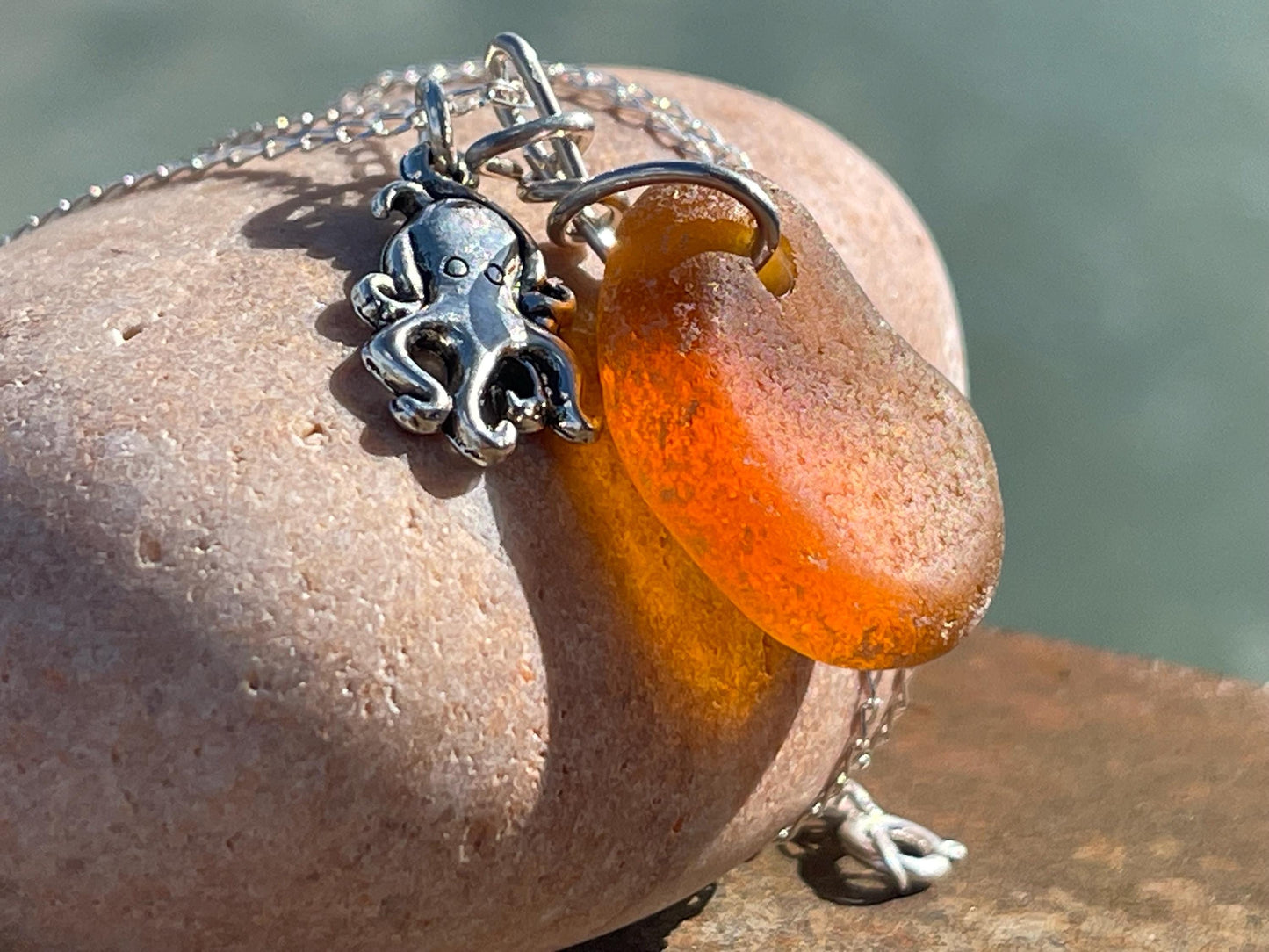 Eco friendly sea glass necklace on a sterling silver chain showcasing a little octopus. Octopus pendant, octopus necklace, ethical jewellery