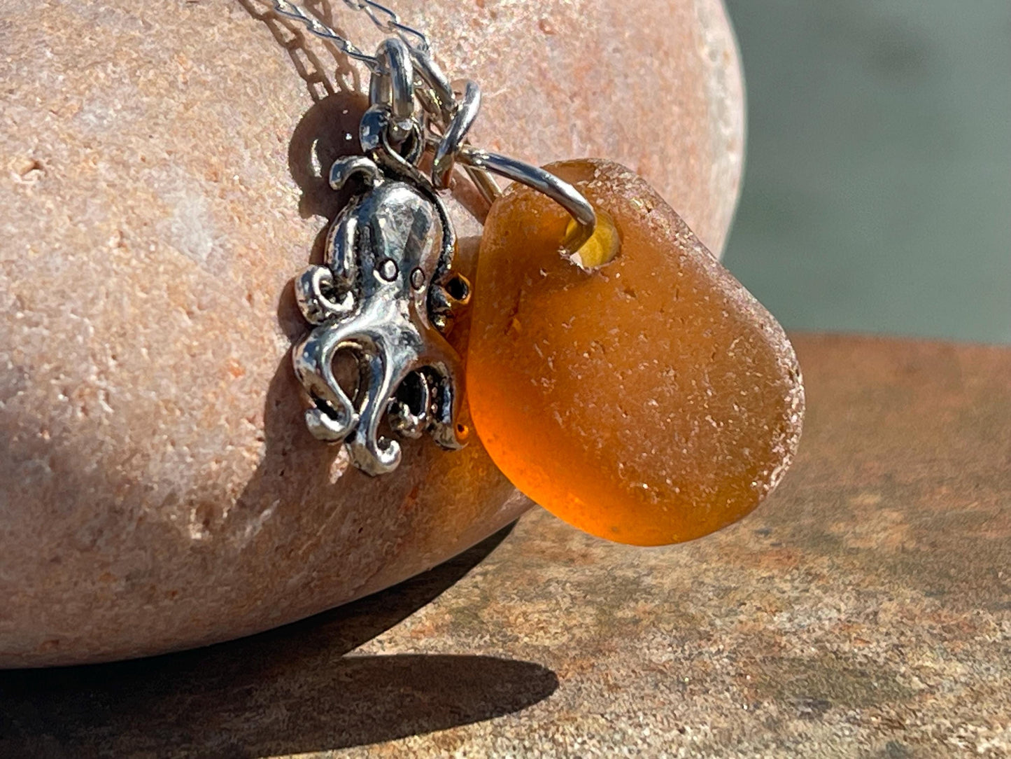 Eco friendly sea glass necklace on a sterling silver chain showcasing a little octopus. Octopus pendant, octopus necklace, ethical jewellery