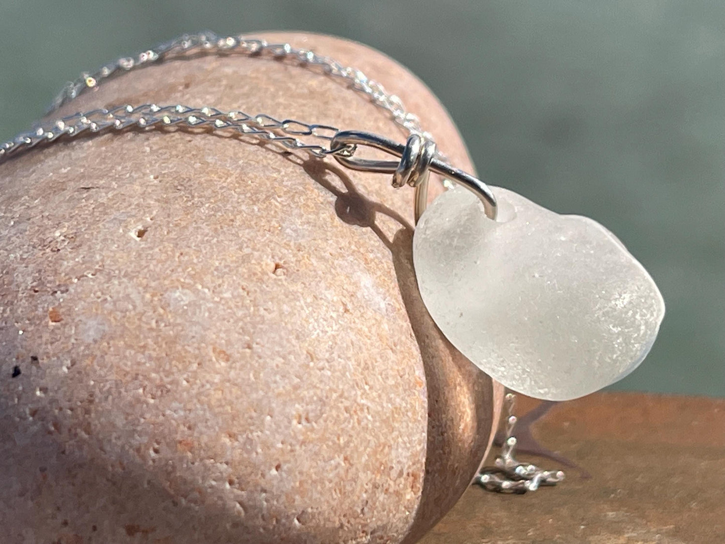 Eco friendly sea glass necklace on a sterling silver chain showcasing a little octopus. Octopus pendant, octopus necklace, ethical jewellery