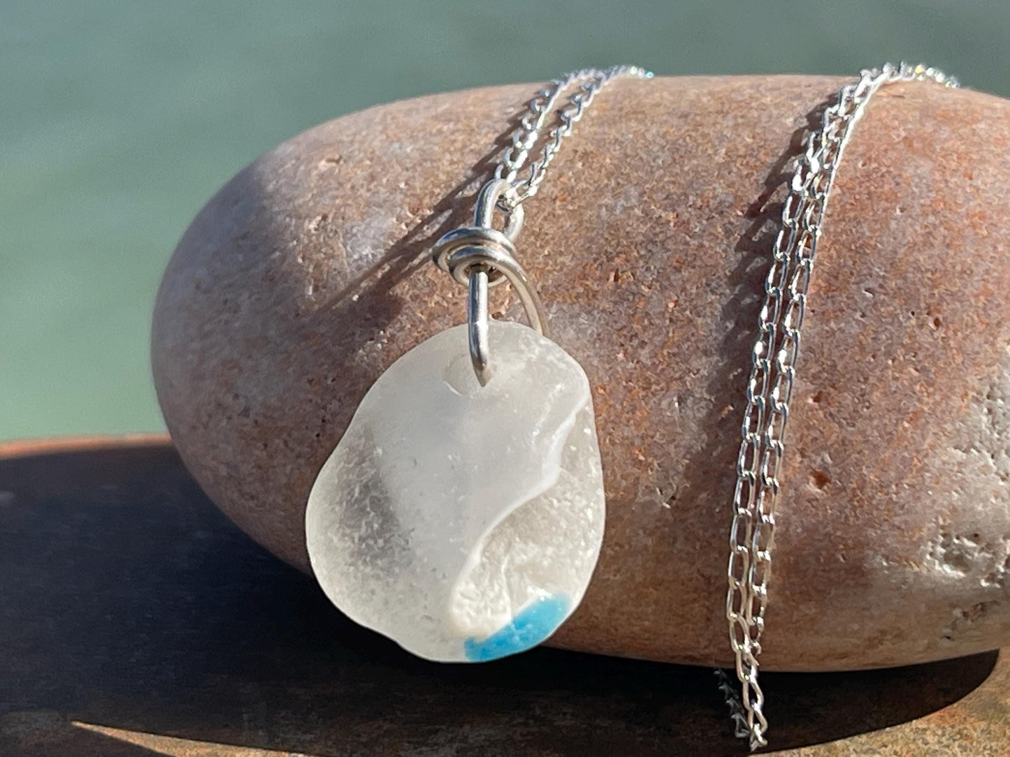 Eco friendly sea glass necklace on a sterling silver chain showcasing a little octopus. Octopus pendant, octopus necklace, ethical jewellery