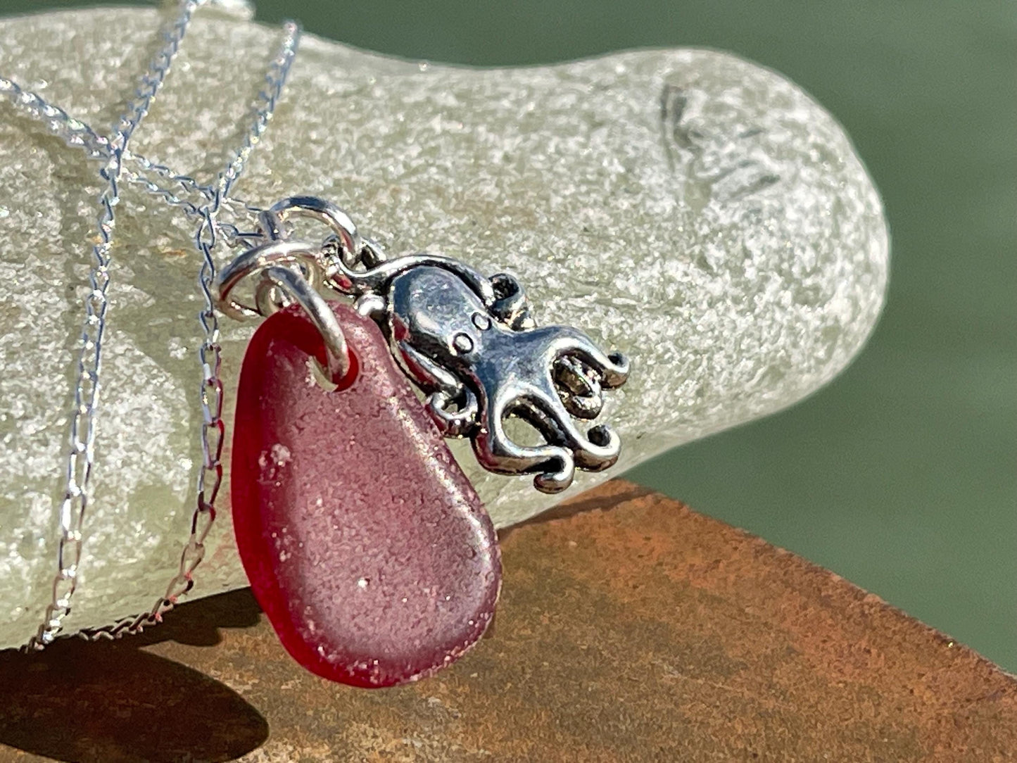 Eco friendly sea glass necklace on a sterling silver chain showcasing a little octopus. Octopus pendant, octopus necklace, ethical jewellery